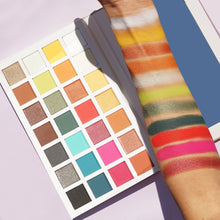 Cargar imagen en el visor de la galería, Vacation Mood is your perfect palette to pack up with you on any trip. This twenty-eight shaded palette has three different finishes to pigmented mattes, velvet-shimmers, and shimmers. Shades range from your blendable neutrals to our exotic electric shades. The best price and deal w/ Bonitawholesale.com