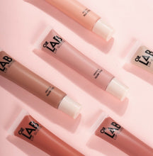 Load image into Gallery viewer, Romantic Beauty- L2004 : OZ Lab Nude Shade Lip Gloss 4 DZ All the benefits of a moisturizer with a non-sticky high-shine finish in nude shades for all skin tones. The comfortable all-day wear lip gloss comes in a traditional applicator that immediately delivers a fuller lip effect. Infused with vitamin E, these tinted nude lip glosses are perfect to use over your favorite matte lipsticks or alone for a natural high-gloss finish. The best price and deal w/ Bonitawholesale.com !!!
