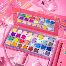 Load image into Gallery viewer, Amor US - DCESD Dazzle Charm 32 Shade Pressed Pigment Palette 6 PCS The Dazzle Charm palette consists of 32 pressed pigments designed to party and stay glam all day and night. Our highly pigmented shades, striking shimmers and light-catching glitters are ready to aid any of your party looks. The best price and deal w/ Bonitawholesale.com !!!