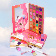 Load image into Gallery viewer, The Enchanted Sky palette consists of 32 pressed pigments designed with the smoothest of texture and pigments for looks out of this world. Levitate with the help of rich mattes, silky shimmers and flirty glitters. The best price and deal w/ Bonitawholesale.com